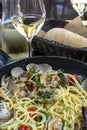 Spaghetti with sea clams, pasta vongole served in cooking pan, tasty italian seafood Royalty Free Stock Photo