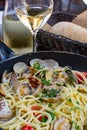 Spaghetti with sea clams, pasta vongole served in cooking pan, tasty italian seafood Royalty Free Stock Photo