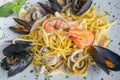 Spaghetti with seafood called spaghetti allo scoglio is a typical seafood dish of italian cuisine