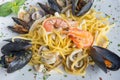 Spaghetti with seafood called spaghetti allo scoglio is a typical seafood dish of italian cuisine
