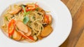 Spaghetti seafood on the dish on the wood table Royalty Free Stock Photo