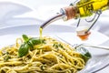 Spaghetti. Spaghetti with homemade pesto sauce olive oil and basil leaves Royalty Free Stock Photo