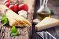 Spaghetti.Spaghetti tomatoes basil olive oil parmesan cheese and mushrooms on very old oak board. Royalty Free Stock Photo