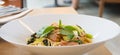 Spaghetti spicy with bacon, parsley and parmesan cheese Fresh pepper, Basil leaf . Pasta Carbonara on white plate. Italian food Royalty Free Stock Photo