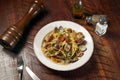 Spaghetti with Spicy Garlic and Clams Vongole served in dish isolated on wooden table top view of italian fast food Royalty Free Stock Photo