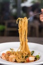 Spaghetti with spicy prawn in white dish