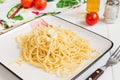 Spaghetti on a square plate
