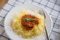 Spaghetti Squash with pesto and cheese