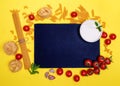 Spaghetti, tagliatelle, pasta, tomatoes, cherries, white souses on yellow background