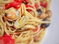 Spaghetti with tiny baby clams in the shell. Royalty Free Stock Photo