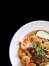 Spaghetti Tom Yum kung on black isolated