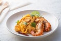 Spaghetti Tom Yum Kung,Thai style fusion food, spicy pasta with Giant freshwater prawns in tom yum sauce Royalty Free Stock Photo