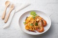 Spaghetti Tom Yum Kung,Thai style fusion food, spicy pasta with Giant freshwater prawns in tom yum sauce Royalty Free Stock Photo