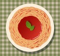 Spaghetti with tomato sauce and basil leaves on a checkered tablecloth