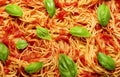 Spaghetti with tomato sauce and basil, top view. Spaghetti background Royalty Free Stock Photo