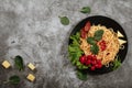 Spaghetti with tomato sauce, cherry tomatoes and basil on a dark background. Tasty appetizing classic italian spaghetti pasta with Royalty Free Stock Photo