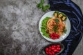 Spaghetti with tomato sauce, cherry tomatoes and basil on a dark background. Tasty appetizing classic italian spaghetti pasta with Royalty Free Stock Photo