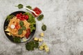 Spaghetti with tomato sauce, cherry tomatoes and basil on a dark background. Tasty appetizing classic italian spaghetti pasta with Royalty Free Stock Photo