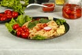Spaghetti with tomato sauce, cherry tomatoes and basil on a dark background. Tasty appetizing classic italian spaghetti pasta with Royalty Free Stock Photo