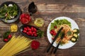 Spaghetti with tomato sauce, cherry tomatoes and basil on a dark background. Tasty appetizing classic italian spaghetti pasta with Royalty Free Stock Photo