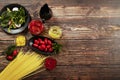 Spaghetti with tomato sauce, cherry tomatoes and basil on a wooden background. Tasty appetizing classic Italian pasta spaghetti wi Royalty Free Stock Photo