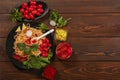 Spaghetti with tomato sauce, cherry tomatoes and basil on a wooden background. Tasty appetizing classic Italian pasta spaghetti wi Royalty Free Stock Photo