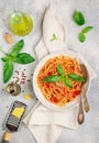 Spaghetti with tomato sauce, fresh Basil, Parmesan cheese, olive oil and spices. Mediterranean Italian cuisine. Delicious pasta Royalty Free Stock Photo