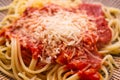 Spaghetti with tomato sauce and grated cheese, fast food for children and bachelors