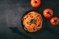 Spaghetti with tomato sauce and minced meat, Parmesan cheese and basil Black background Royalty Free Stock Photo