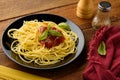 Spaghetti with tomatoe sauce and their ingredients arround,adjustment size for banner,cover and header. Royalty Free Stock Photo