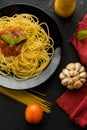Spaghetti with tomatoe sauce and their ingredients arround,adjustment size for banner,cover and header. Royalty Free Stock Photo