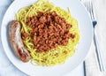 spaghetti top with a hmeat sauce and parsley