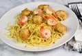 spaghetti top with scallops and hrimp