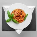 Spaghetti tuna pasta basil plate triangle shape slate table pretty Royalty Free Stock Photo