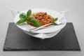 Spaghetti tuna pasta basil plate triangle shape slate table pretty