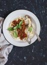 Spaghetti with vegetarian lentil bolognese on a dark background. Royalty Free Stock Photo