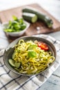 Spaghetti zucchini raw vegan pasta with feta cheese cucumber and basil