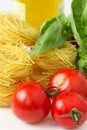 Spaghettii,leaves of basil and tomatoes Royalty Free Stock Photo