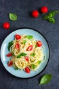 Spaghetty pasta with cherry tomatoes, basil and parmesan chees