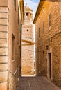 Spain, alley with church steeple of mediterranean village on Majorca Royalty Free Stock Photo