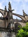 Spain, Andalusia, Seville Cathedral, outer walls with Gothic tracery windows, pointed spires