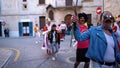 SPAIN, BARCELONA-13 APR 2019: Young people marching on holiday in modern costumes. Art. Spanish festive procession