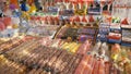SPAIN, BARCELONA - April , 2018: Show-window with sweets and olive oil in the Boqueria market. Stock. Shop with sweets