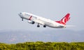 SPAIN, BARCELONA - AUGUST 18, 2023: Turkish Airlines Boeing 737 airplane takes off from Barcelona