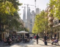SPAIN, BARCELONA - OCT 21, 2018 : Cafe restaurant Cozy street in Barcelona city street People walking Sagrada Familia Architecture