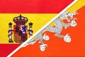 Spain and Bhutan, symbol of two national flags from textile. Partnership between European and Asian countries