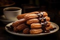 Spain. Churros with sugar and chocolate sauce on woodewn table. Churros are traditional Spanish desserts,