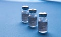 Spain - February 09, 2021 Close up picture of three empty phials of Pfizer COVID19 vaccine with a needle. Selective focus