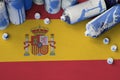 Spain flag and few used aerosol spray cans for graffiti painting. Street art culture concept