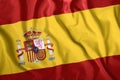 The Spain flag flies in the wind. Colorful national flag of the Spain. Patriotism, patriotic symbol